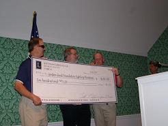 Photo of the donation check from the 2008 tournament
